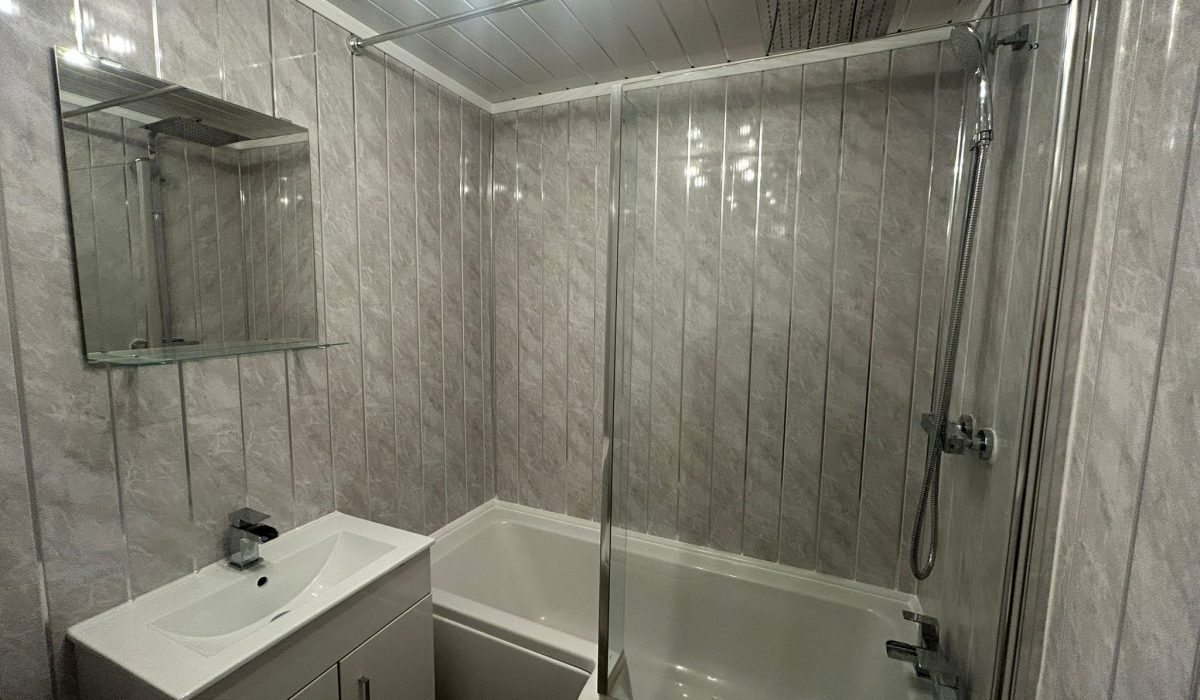 Family bathroom with bath, overhead shower and vanity basin